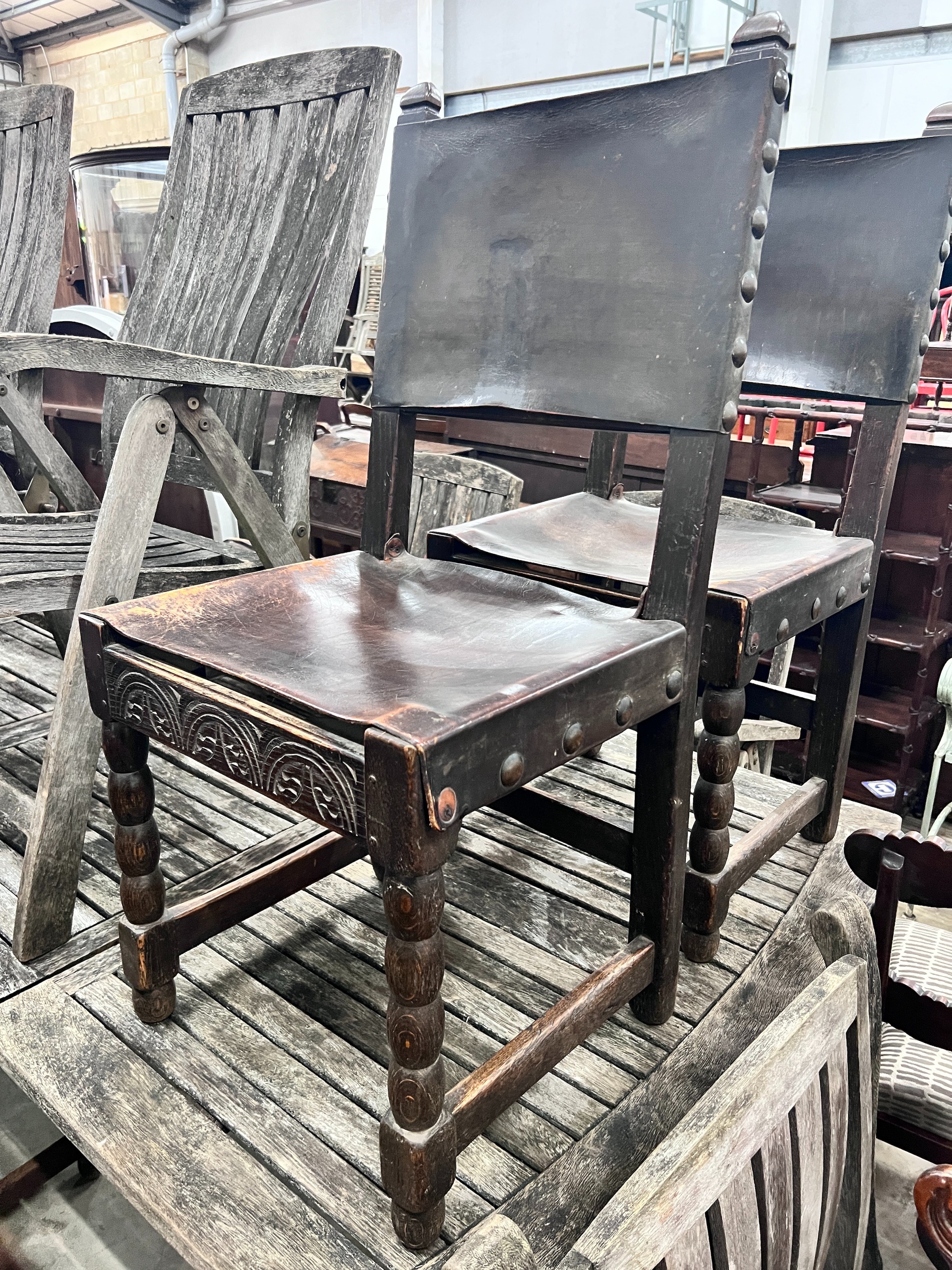 A set of six 17th century style oak dining chairs with leather upholstery *Please note the sale commences at 9am.